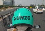 A Dunzo biker makes a quick delivery in Delhi.