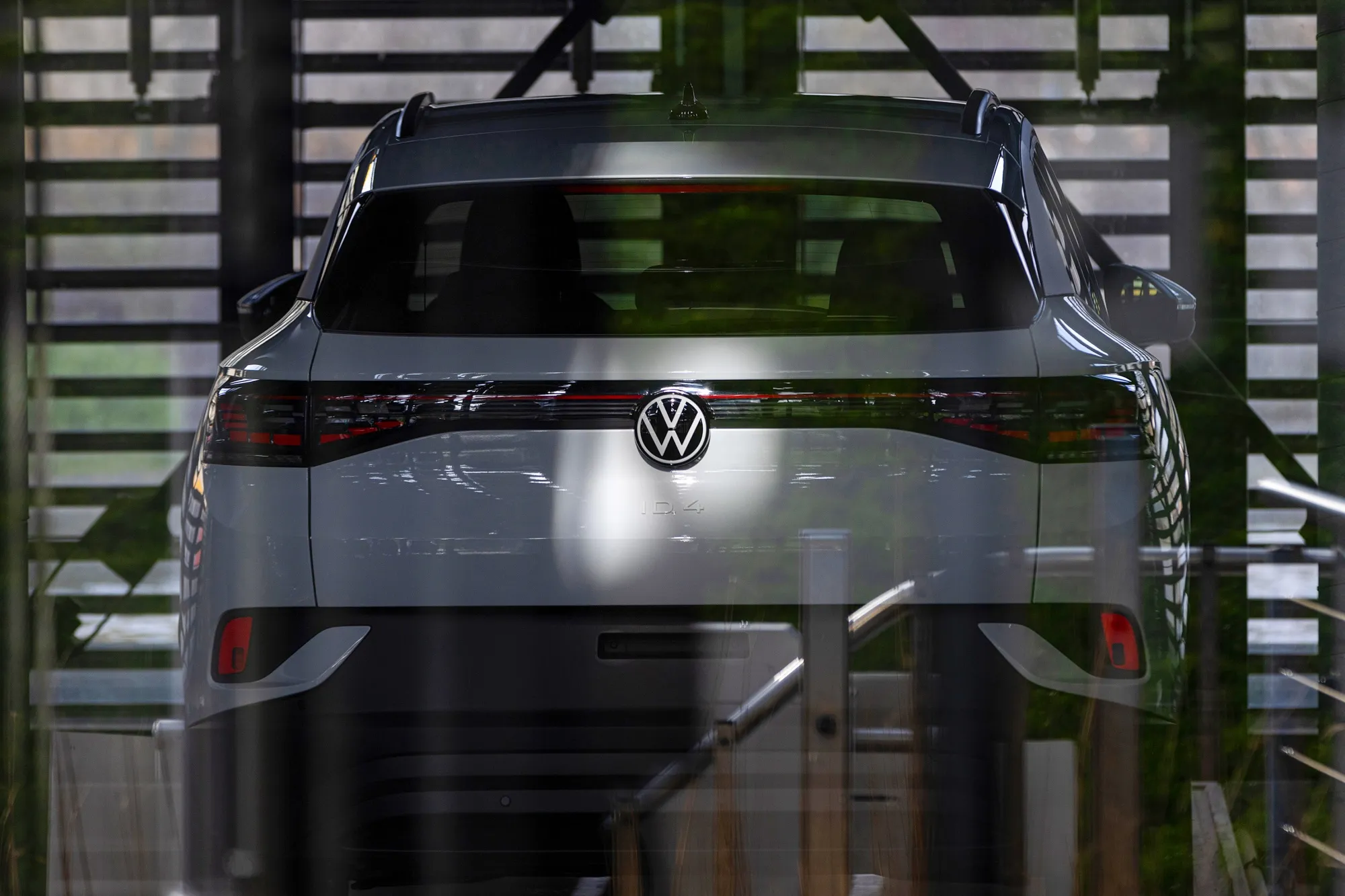 A VW ID.4 electric vehicle inside the Autostadt delivery tower at the Volkswagen AG auto plant complex in Wolfsburg.