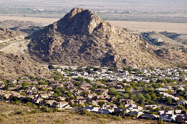 A housing development sits nestled into the South Mountain foothills in the Ahwatukee neighborhood of Phoenix  on Dec. 4, 2012