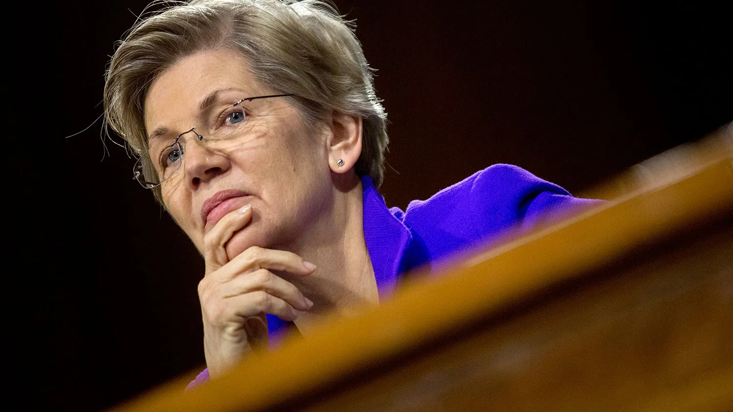 Senator Elizabeth Warren, a Democrat from Massachusetts, listens during a Senate Banking Committee hearing with Janet Yellen, chair of the U.S. Federal Reserve, not pictured, in Washington, D.C., U.S., on Tuesday, Feb. 24, 2015.
