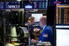 Traders work on the floor of the New York Stock Exchange (NYSE) in New York, U.S..