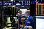 Traders work on the floor of the New York Stock Exchange (NYSE) in New York, U.S..