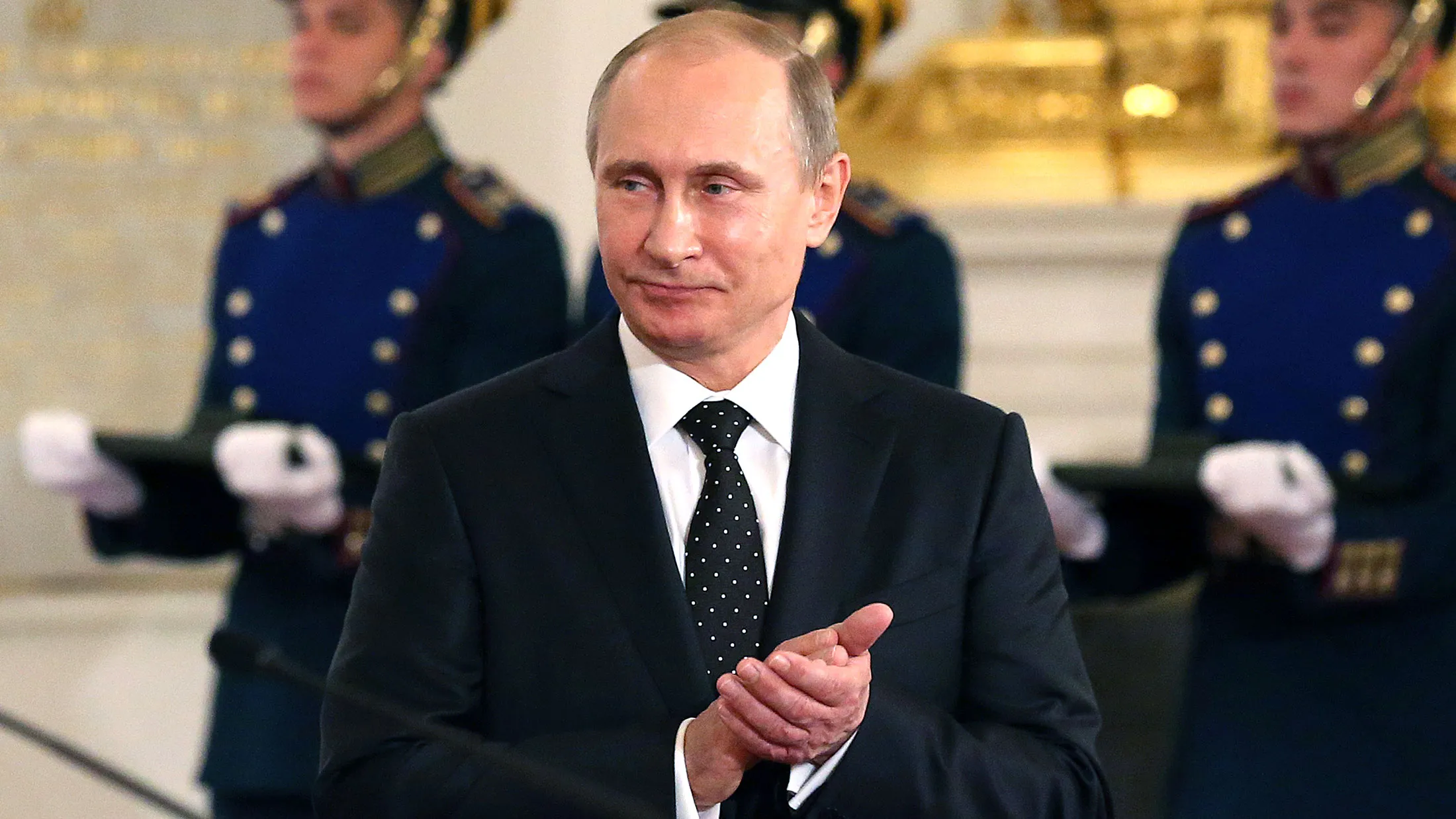 Russian President, Vladimir Putin applauds during a presentation ceremony of state awards marking the Day of Russia in the Grand Kremlin Palace in Moscow on June 12, 2015.
