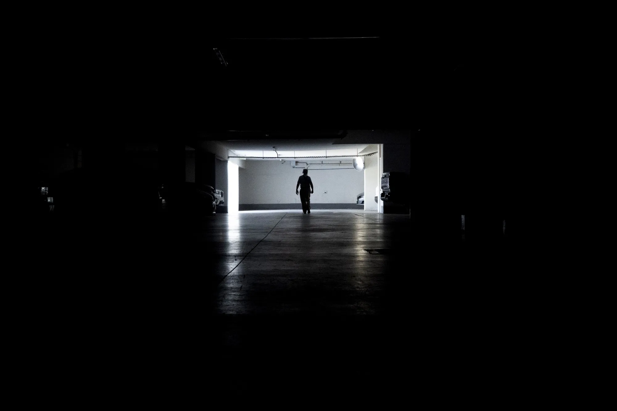 A resident in a parking garage during a power outage in Santiago, Chile, on Feb. 25.