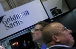 Traders work at the Goldman Sachs Group Inc. booth on the floor of the New York Stock Exchange (NYSE) in New York.