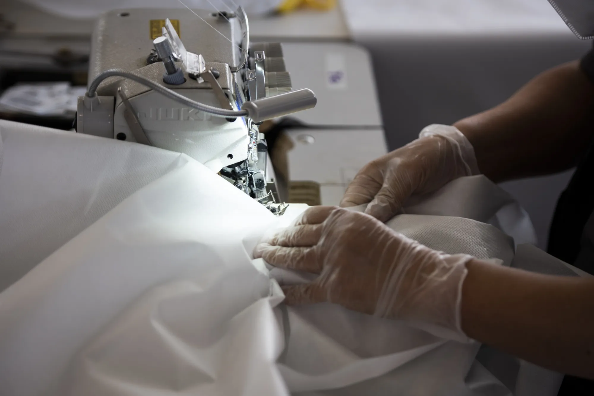A worker sews a polypropylene gown for medical workers&nbsp;in Brooklyn, New York.