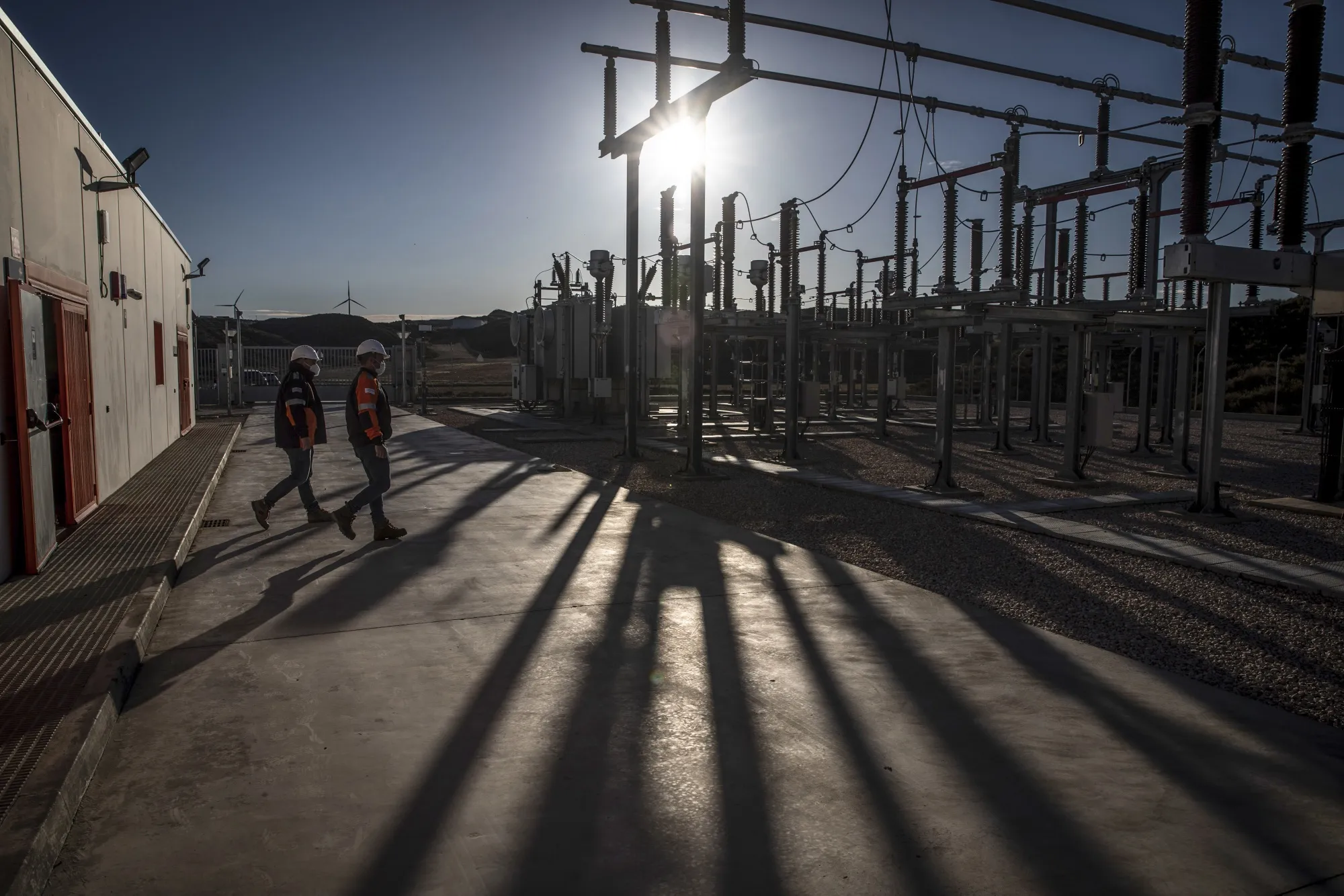 Engineers inspect equipment at an electrical substation in Zaragoza, Spain.