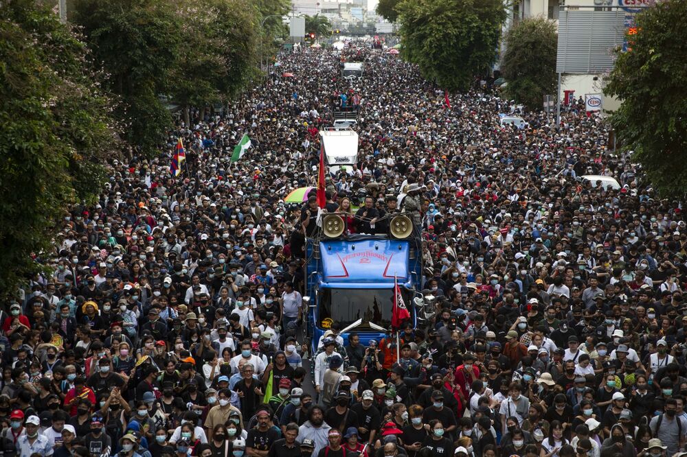 Protesters march towards Government House and the offices of the Prime Minister during a rally in Bangkok on Oct. 14.