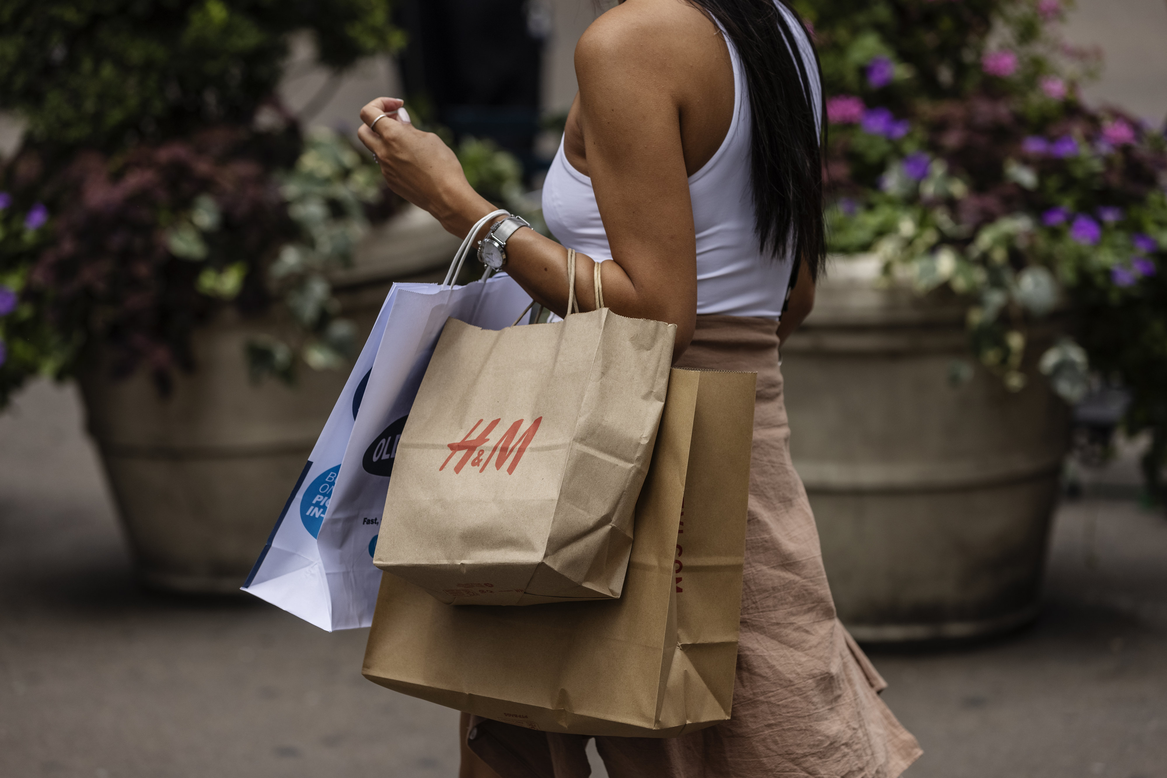 A shopper&nbsp;in New York on July 28. Consumer spending slowed to a 1% annualized growth rate from 1.8% for the first quarter.