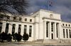 A U.S. flag flies on top of the Marriner S. Eccles Federal Reserve building in Washington.