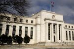 A U.S. flag flies on top of the Marriner S. Eccles Federal Reserve building in Washington.