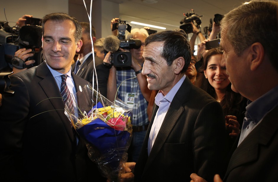 Los Angeles Mayor Eric Garcetti, left, introduces Ali Vayeghan, an Iranian citizen with a valid U.S. visa who was previously turned away from LAX under President Donald Trump's executive order barring people from seven Muslim-majority nations.