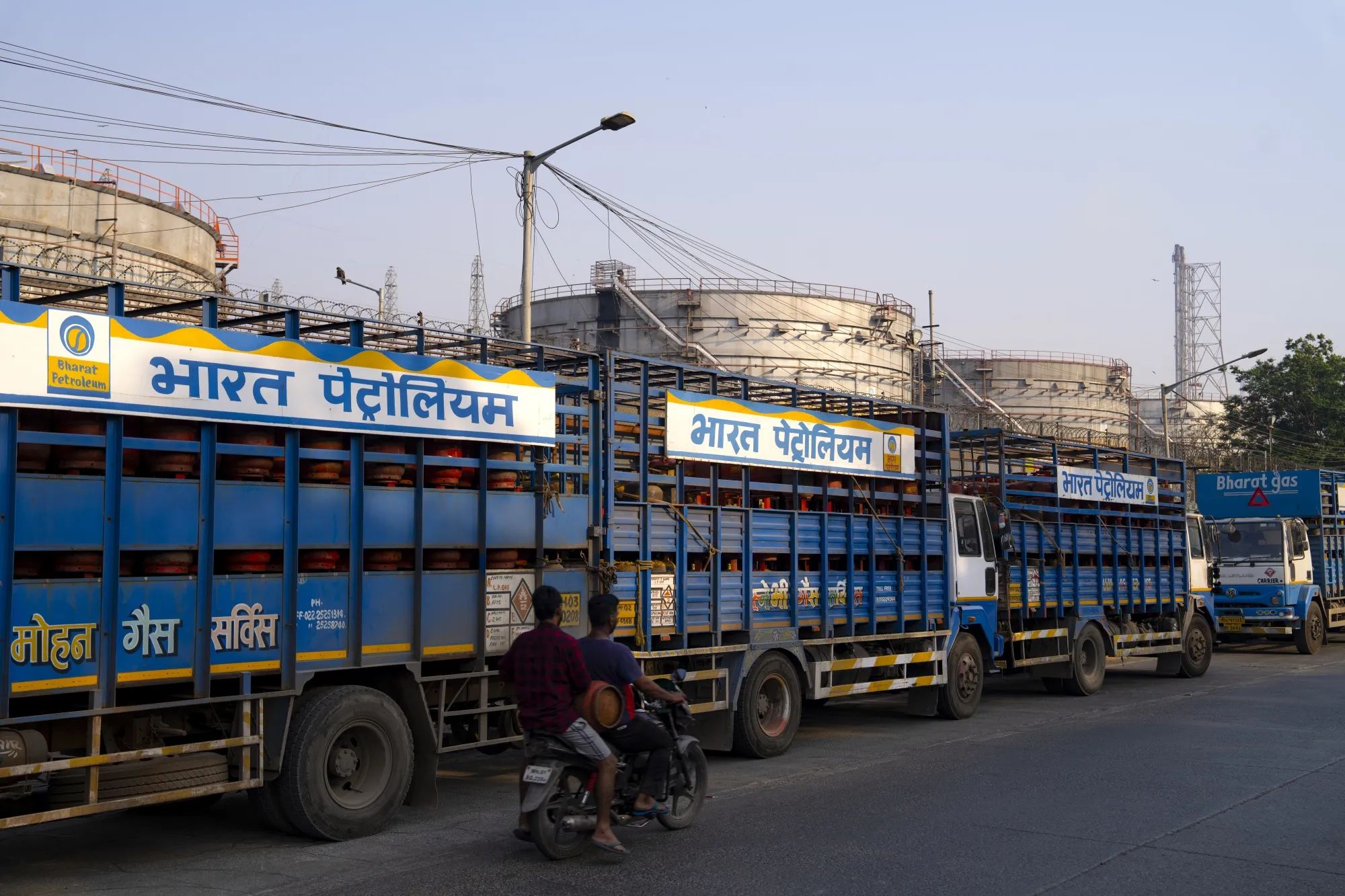 Trucks loaded with gas cylinders at the Bharat Petroleum Corp. oil refinery in Mumbai.