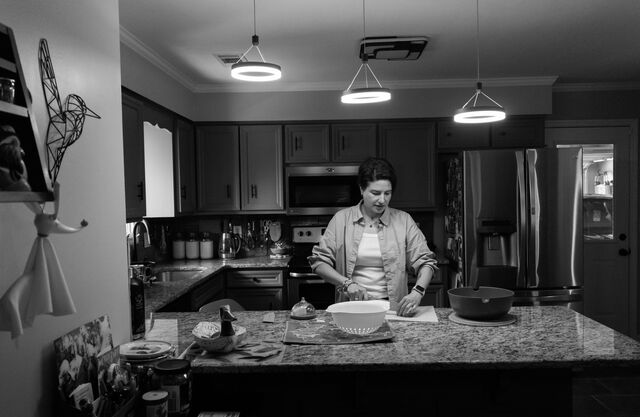  Kosareva prepares a salad inside the kitchen of her home. 