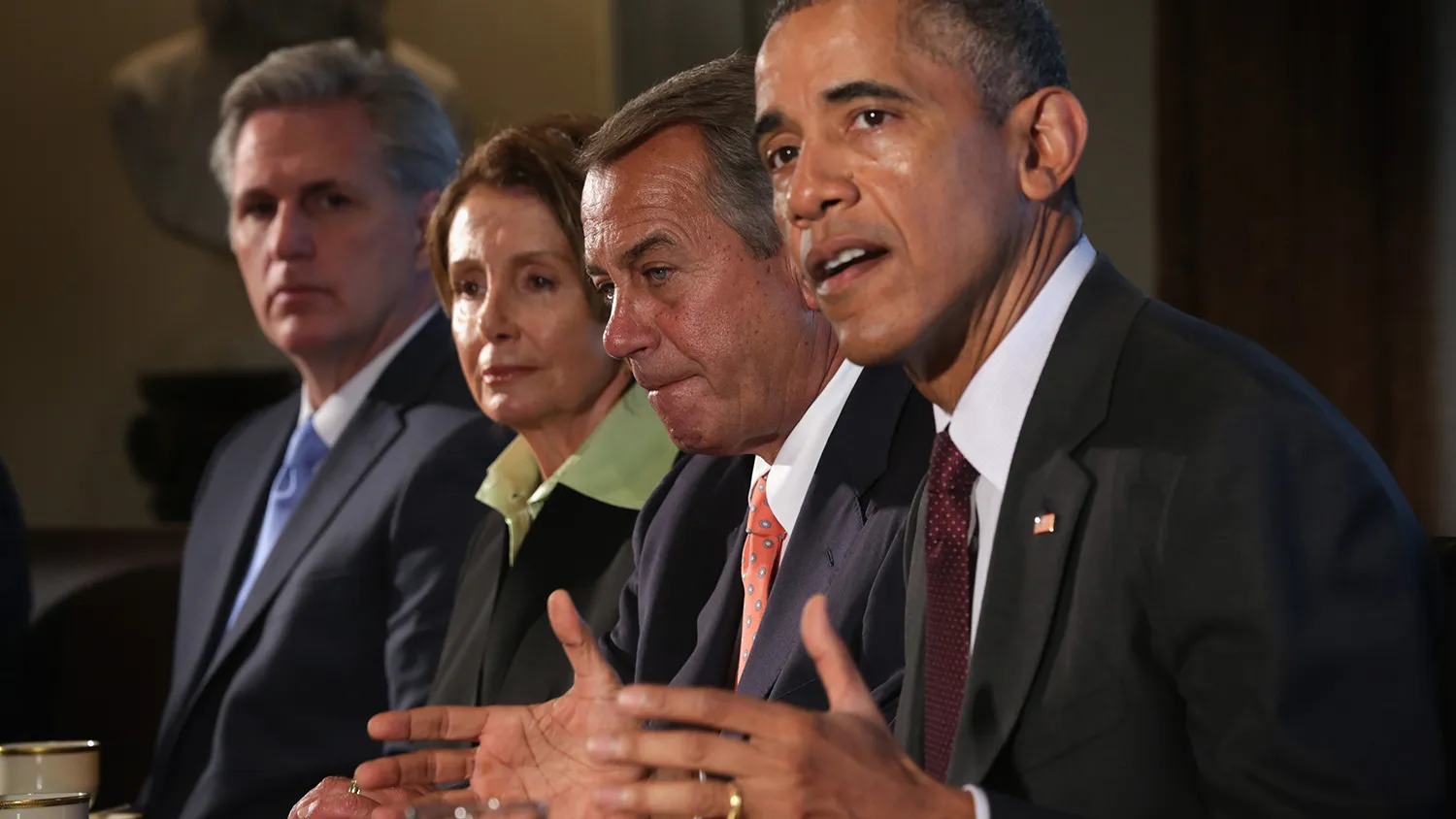 U.S. President Barack Obama (R) speaks as Speaker of the House Rep. John Boehner (R-OH) (3rd L), House Minority Leader Rep. Nancy Pelosi (D-CA) (2nd L), and House Majority Leader Rep. Kevin McCarthy (R-CA) (L) listen during a meeting in the Cabinet Room of the White House January 13, 2015 in Washington, DC.
