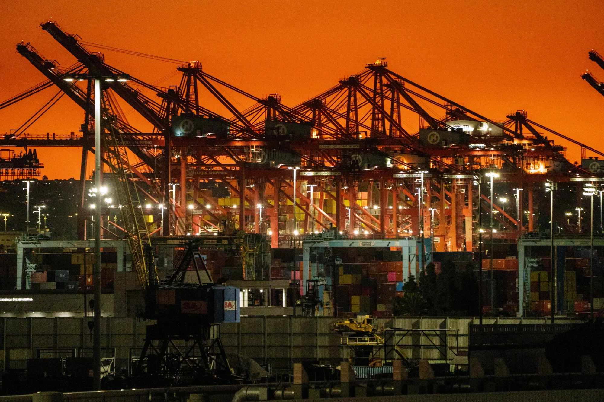 Cranes and shipping containers at the Port of Long Beach in Long Beach, California, US, on Friday, Feb. 20, 2026.