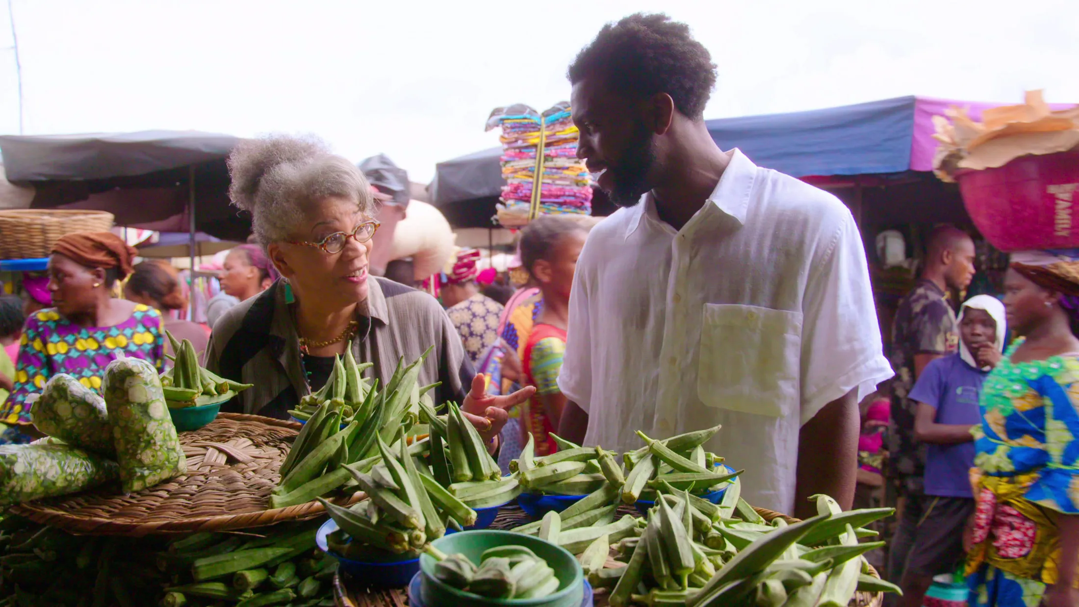 Jessica B. Harris (left)&nbsp;and Stephen Satterfield explore a market in Benin, on Africa’s&nbsp;west coast,&nbsp;in a&nbsp;new Netflix documentary,&nbsp;High on the Hog.
