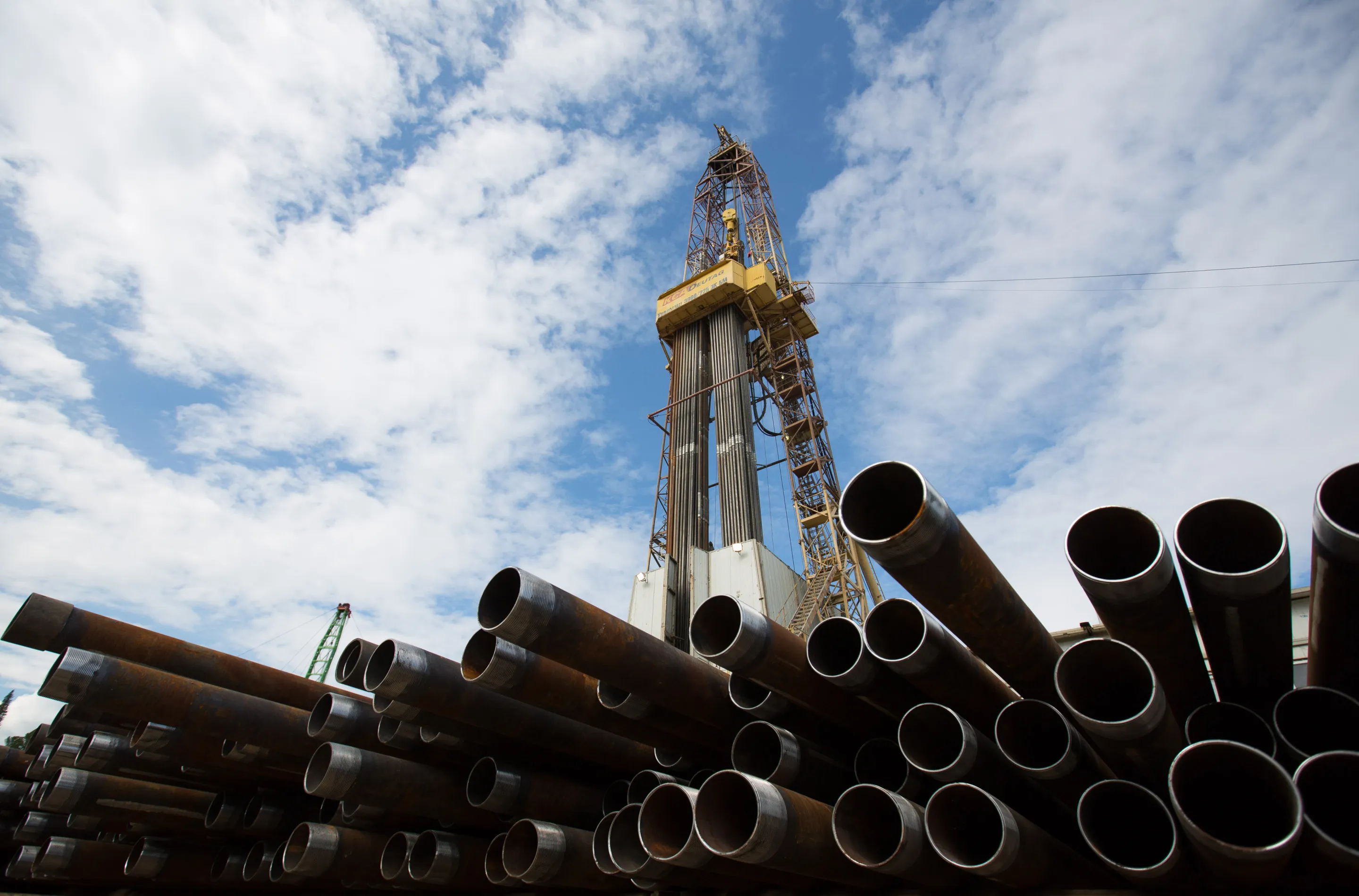 Drill pipe sections near an oil derrick in the&nbsp;Khanty-Mansi autonomous region, Russia.