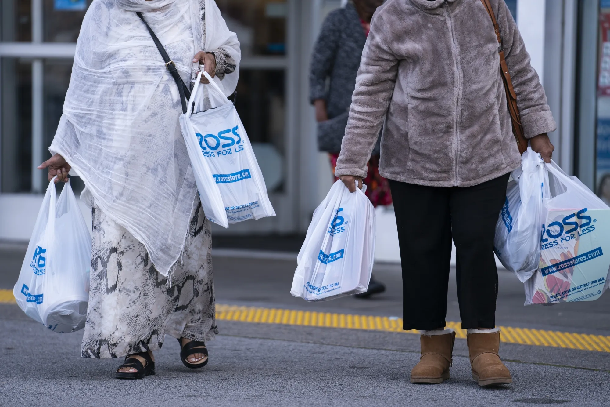 Shoppers carry Ross Stores bags in Hyattsville, Maryland.