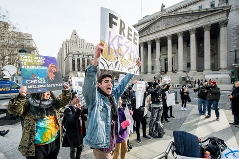 Michael Eisley (center), who runs the Kesha Today Twitter account, organized Kesha fans to protest Sony Music Entertainment outside New York State Supreme Court on Feb. 19 in New York.