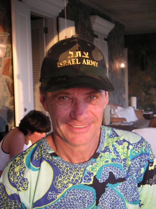 Jean-Luc Brunel during a visit to Epstein’s luxury Caribbean retreat in 2003, with Maxwell in the background.