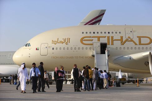 Visitor line up to access an Airbus A380-800 aircraft during the Dubai Air Show in 2015.