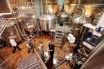 Workers gather in the brewhouse at Brooklyn Brewery on Oct. 23, 2012