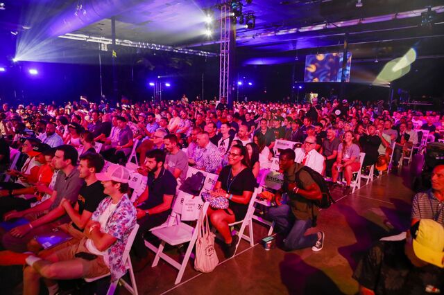 Attendees arrive for the Bitcoin 2021 conference in Miami, Florida, U.S., on Friday, June 4, 2021. The biggest Bitcoin event in the world brings a sold-out crowd of 12,000 attendees and thousands more to Miami for a two-day conference.