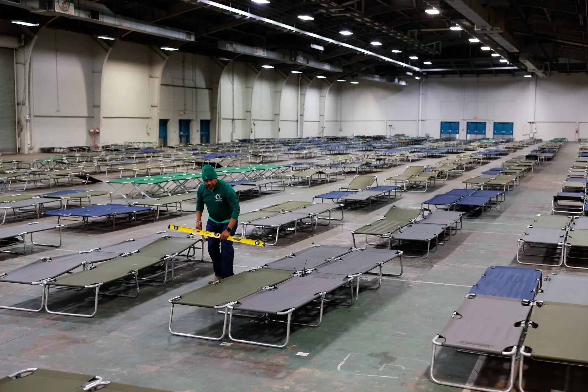 Volunteers prepare cots at an inclement weather shelter  in Dallas, Texas.