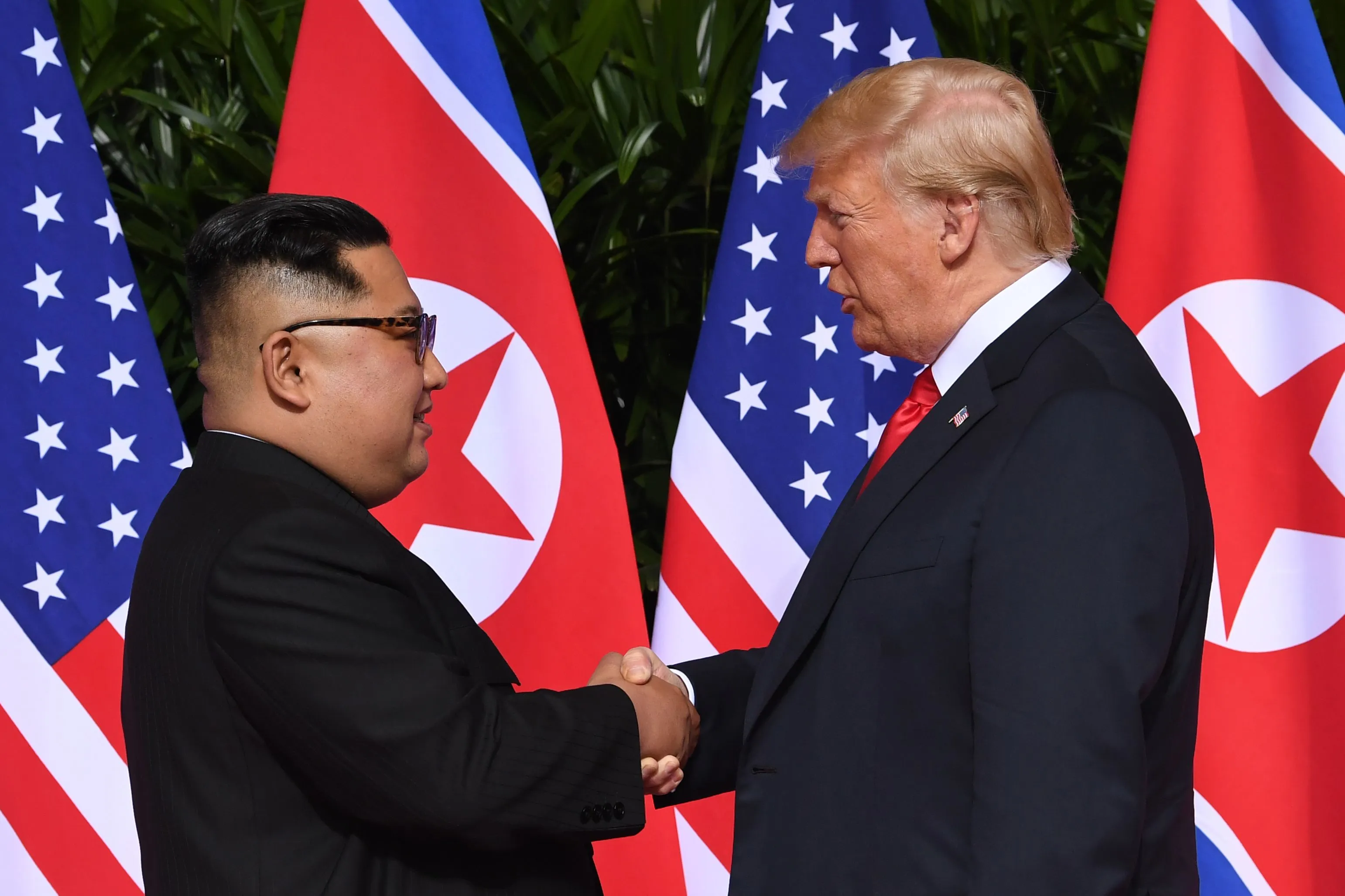 Kim Jong Un shakes hands with Donald Trump in Singapore on June 12.