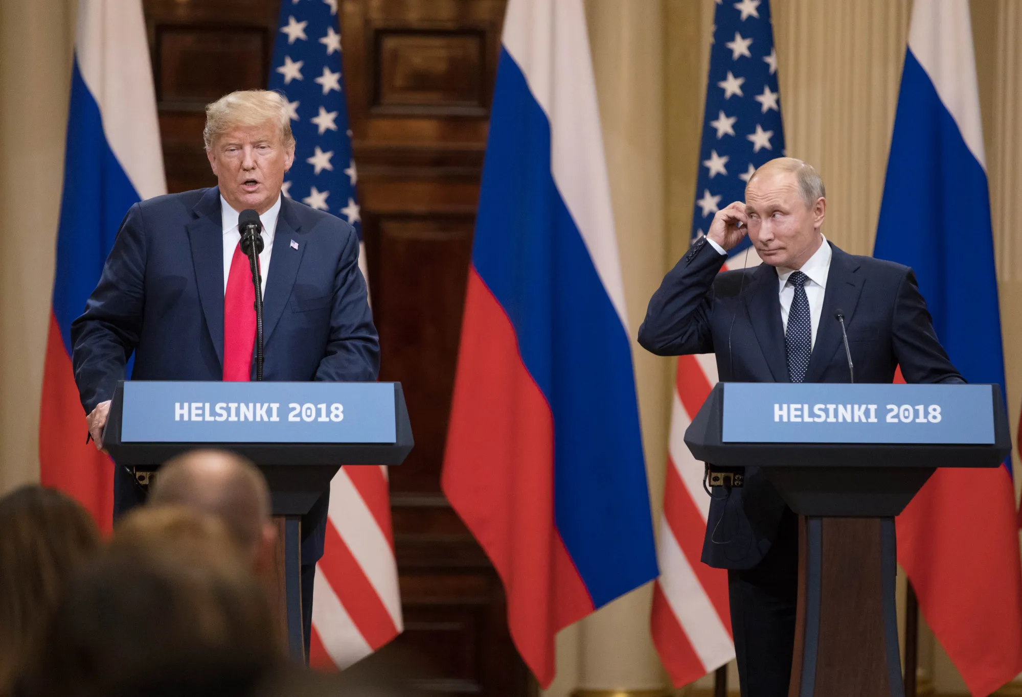 U.S. President Donald Trump, left, speaks&nbsp;as Vladimir Putin, Russia's president, listens during a news conference in Helsinki.
