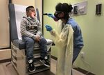 A 7-year-old boy from Guatemala is tested for Covid-19 in Stamford, Connecticut, in May.
