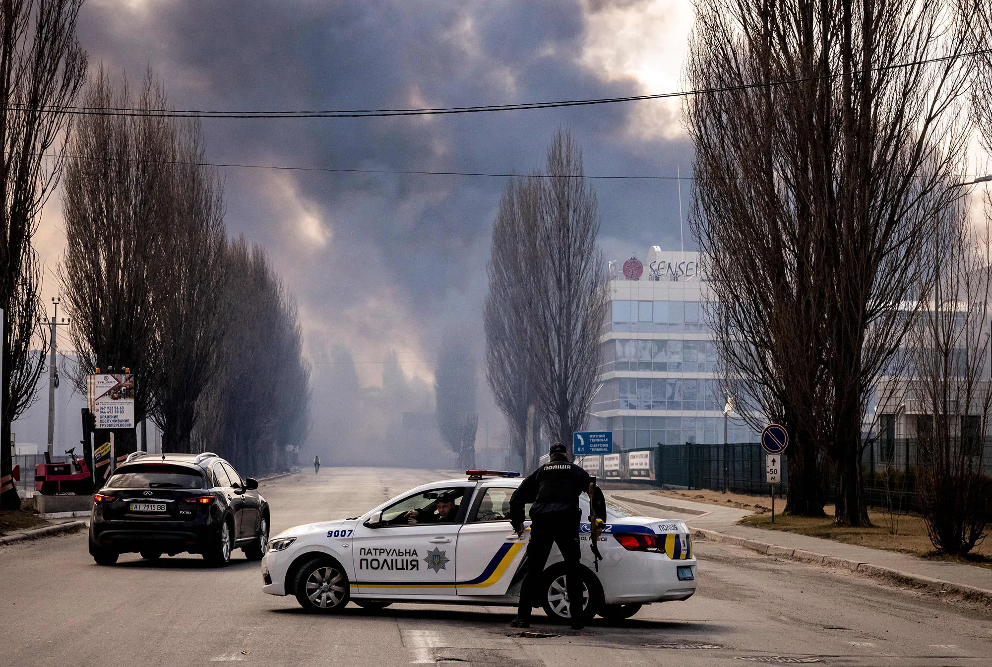 A police office near a fire in Kyiv on March 24.