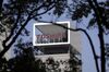 Signage for Toshiba Corp. is displayed atop the company's headquarters in Tokyo, Japan.