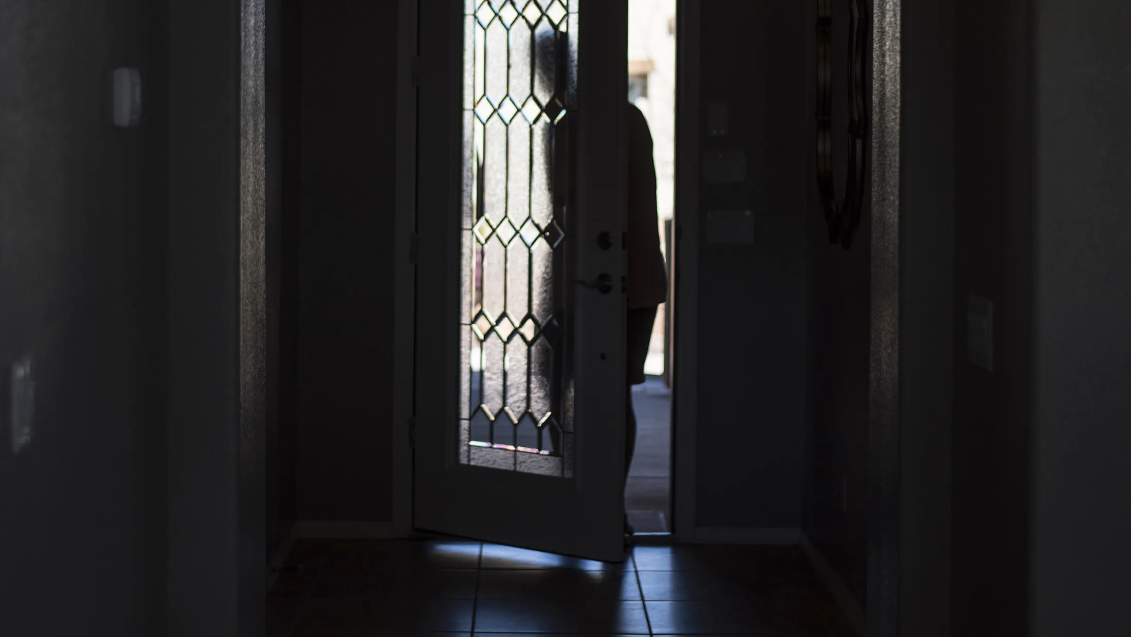 A man exits a model home at a development site in Albuquerque, New Mexico.

