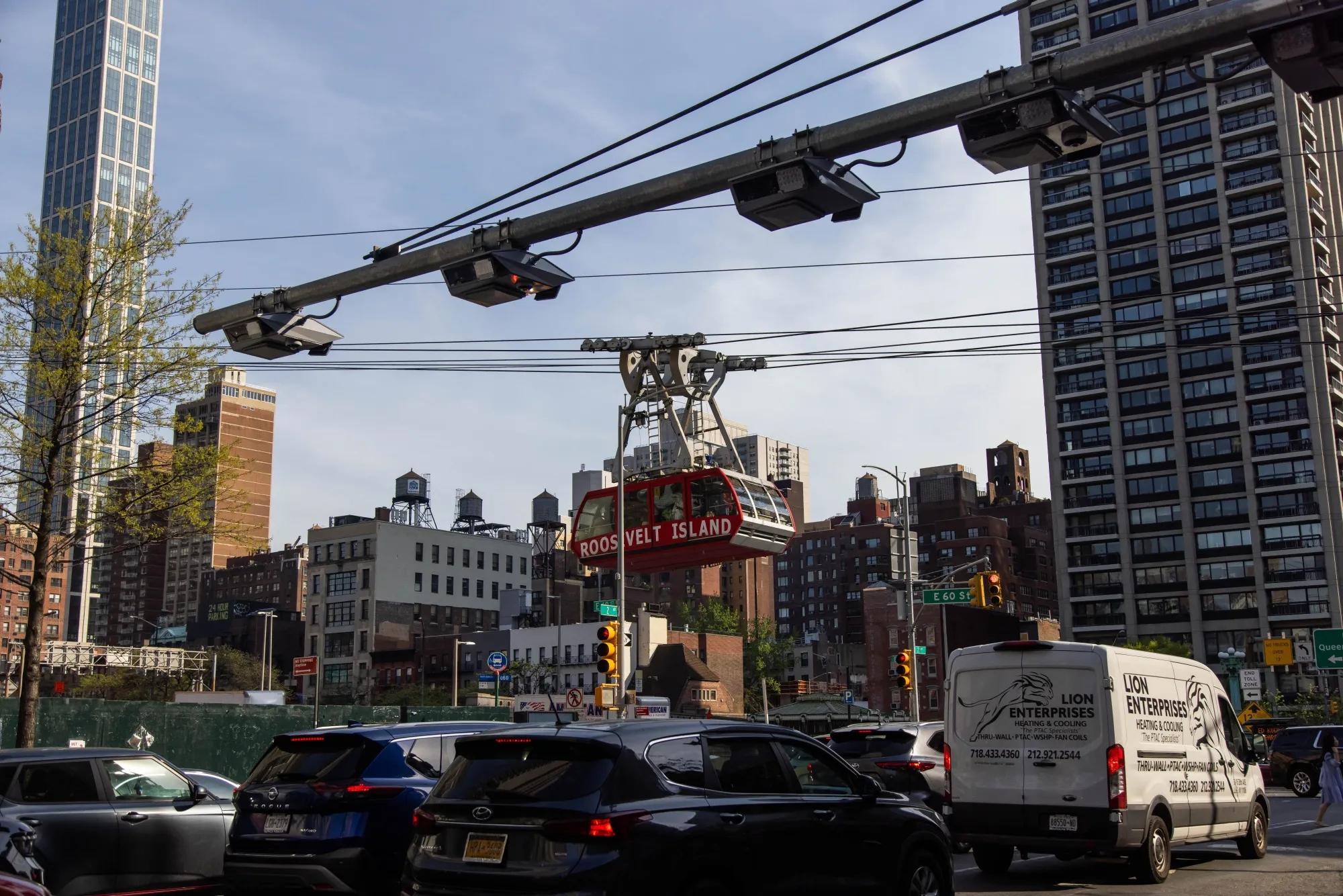 E-ZPass readers and license plate-scanning cameras over Second Avenue in New York.