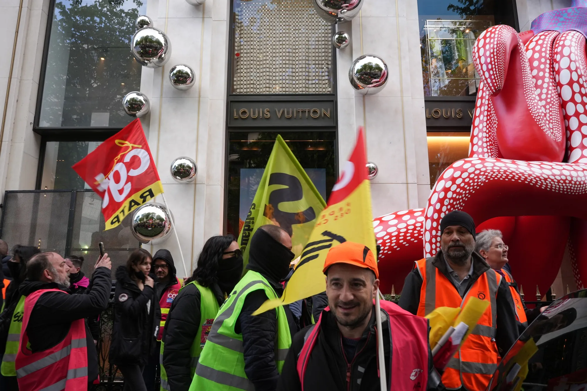 Protestors outside a Louis Vuitton store in central Paris.