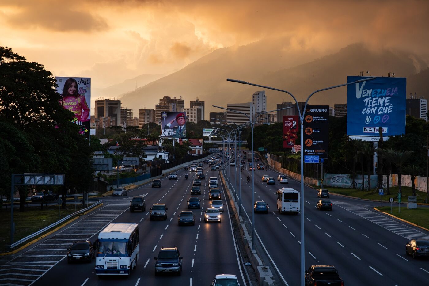 Government-issued billboards compete with commercial advertisements along the main artery&nbsp;in Caracas, Venezuela.&nbsp;
