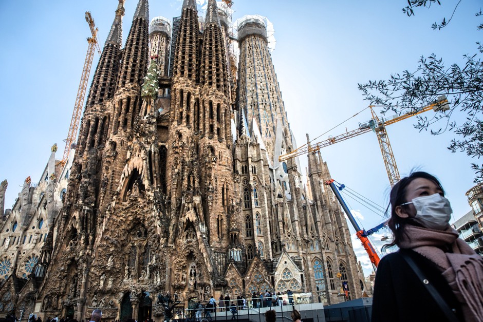A lone tourist in Barcelona, one of several global cities that have seen a massive crash in Airbnb bookings.