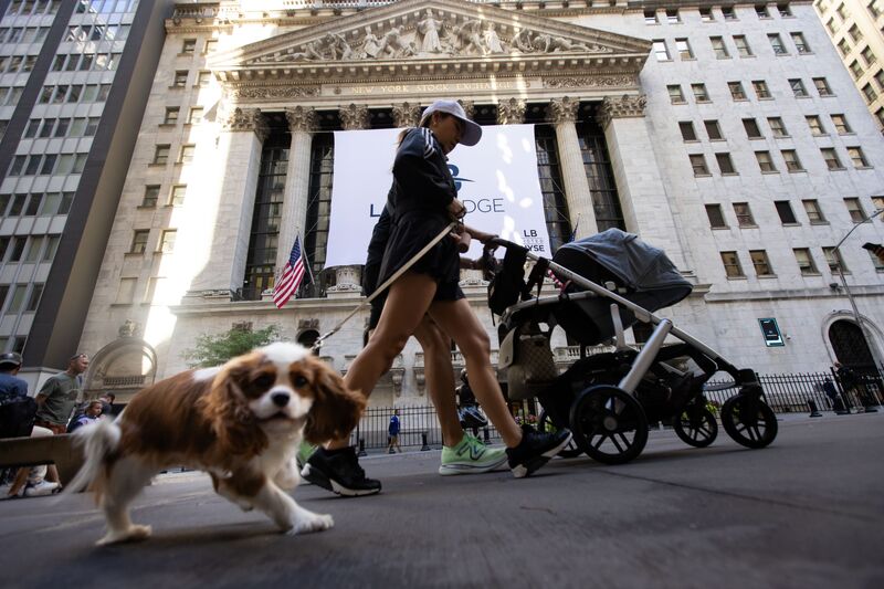 Pedestrians pass in front of the New York Stock Exchange (NYSE) in New York, US, on Friday, June 28, 2024. 