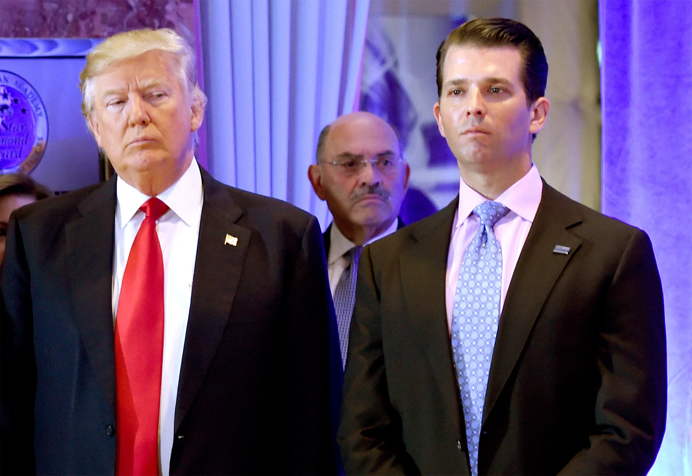 Allen Weisselberg, center, is seen with Donald Trump, left, and Donald Trump Jr. on Jan. 11, 2017. 
