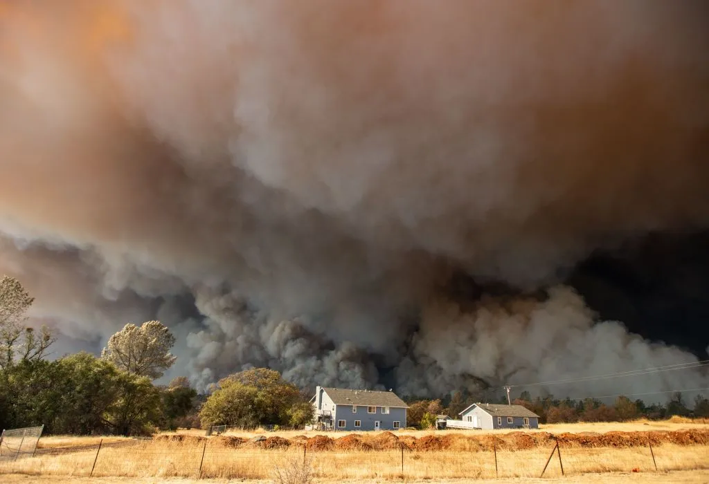 A 2018 wildfire races through the town of Paradise, California.