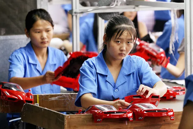 Workers on a production line at a toy factory in China
