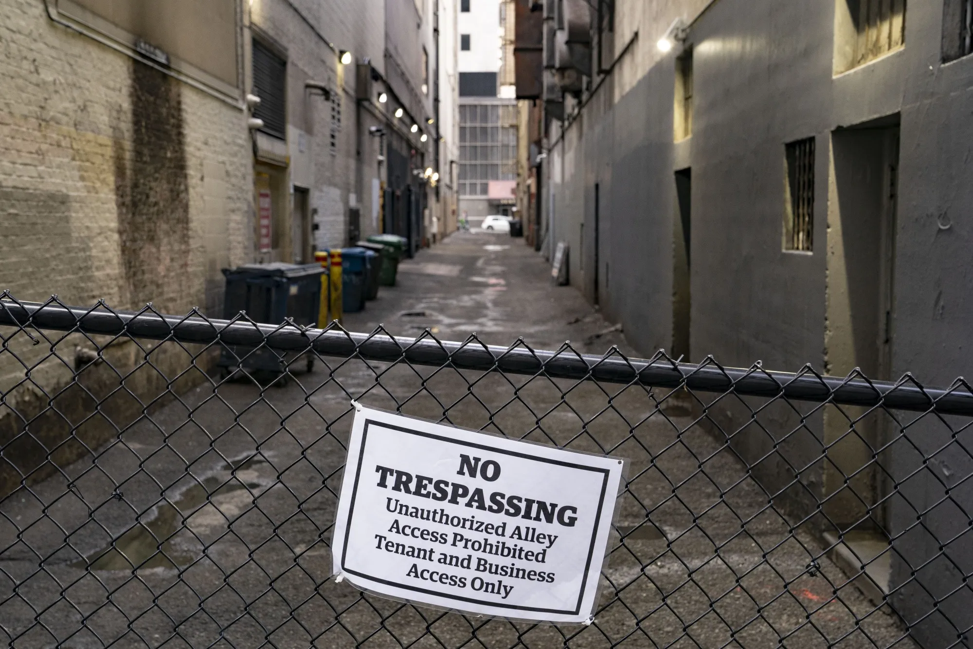 A sign warns people to stay out of an alley near Third Avenue in downtown Seattle.