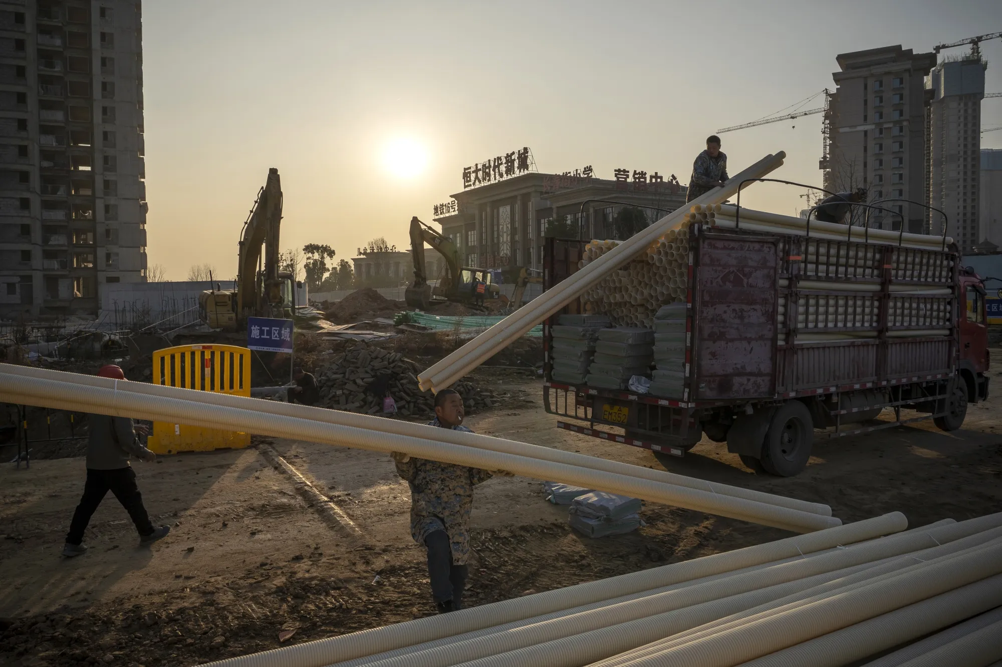 Workers at the construction site of a China Evergrande Group development in Wuhan on&nbsp;Dec. 22.
