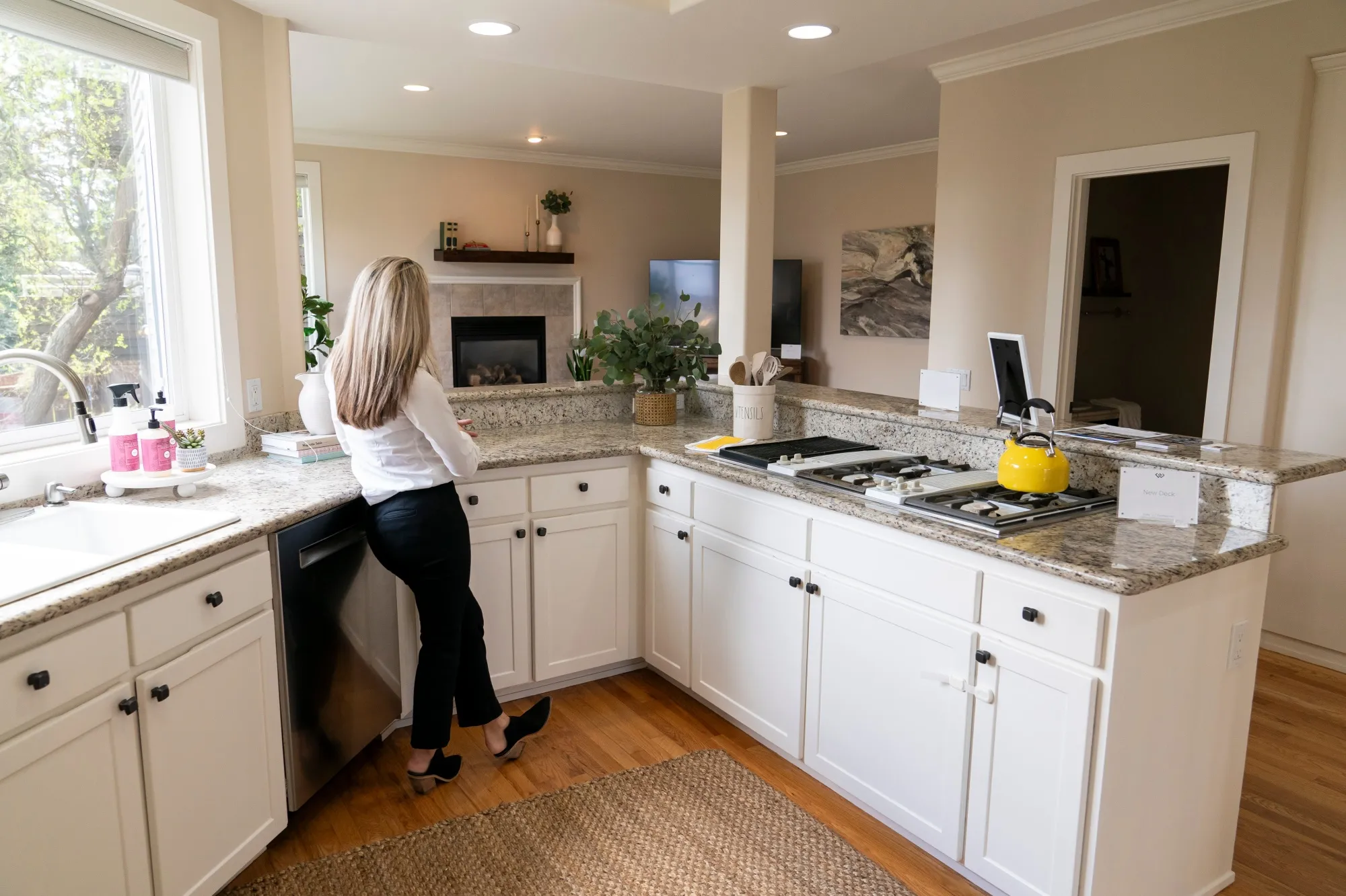 A realtor stands in the kitchen of a home during an open house in Seattle, Washington.