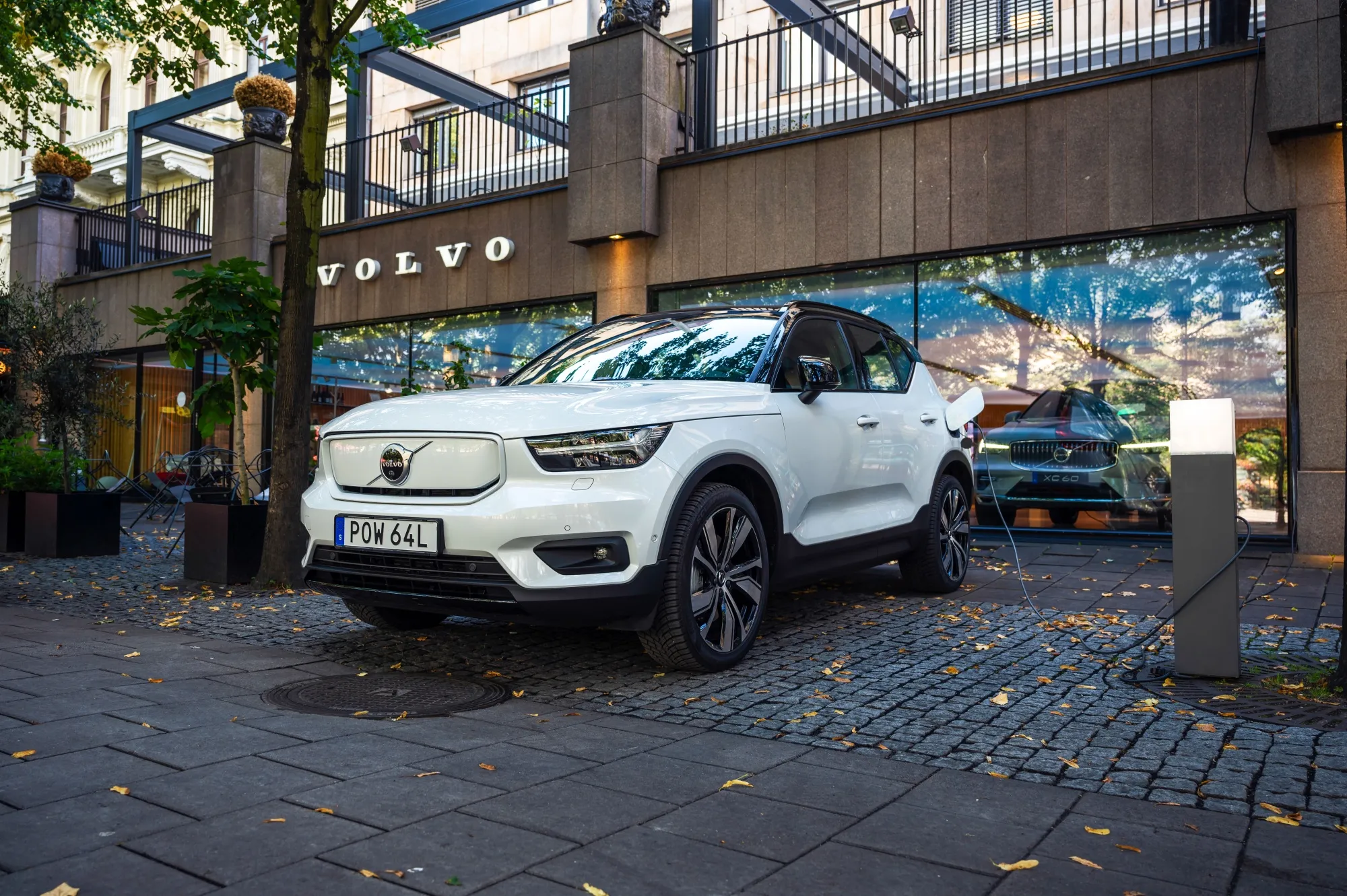 An electric SUV charges outside a Volvo Cars AB dealership in Stockholm, Sweden.