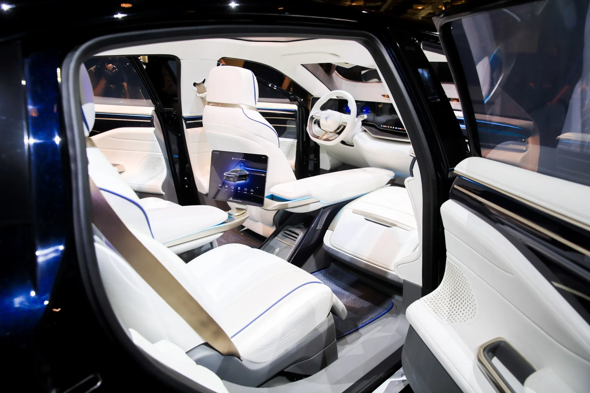 The interior of Foxconn Technology Group's Foxtron Model E concept electric sedan unveiled at the Hon Hai Tech Day event in Taipei, Taiwan, on Monday, Oct. 18, 2021. Foxconn unveiled its first electric vehicles, a milestone that could boost the Taiwanese electronics manufacturer's credentials as a serious bidder for Apple Inc.'s secretive automotive project.