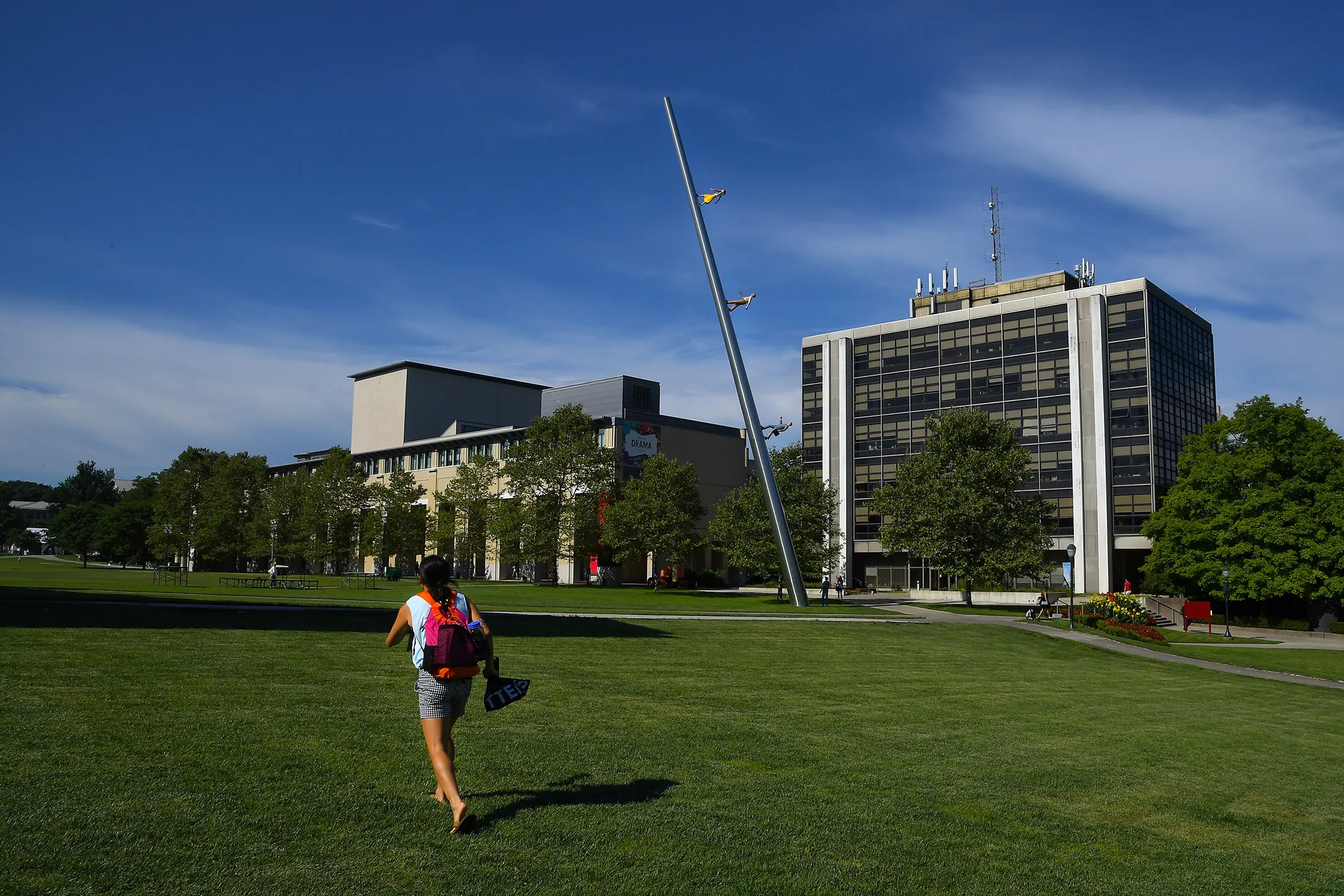 A student walks across The Cut on the campus of Carnegie Mellon University in Pittsburgh, Pennsylvania.