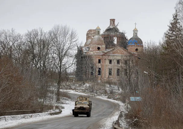 An armoured Ukrainian military vehicle coming from the direction of Sumy heads toward the Russian border.